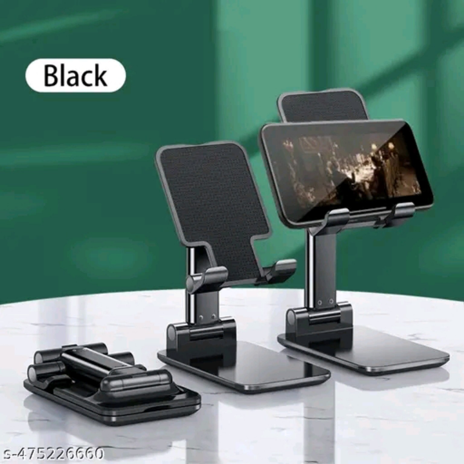 Black mobile holder shown folded, raised and holding a phone